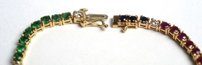 Lot 501 - A diamond, ruby, sapphire and emerald tennis bracelet