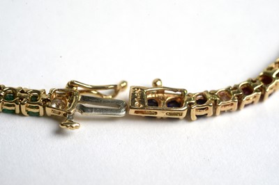 Lot 501 - A diamond, ruby, sapphire and emerald tennis bracelet