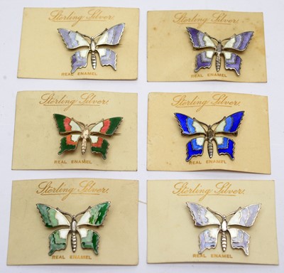 Lot 149 - Six silver and enamel butterfly pattern brooches