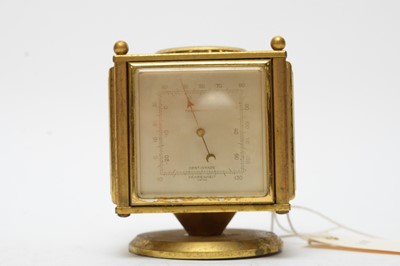 Lot 244 - An Imhof lacquered brass combination timepiece