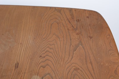 Lot 29 - Ercol: a Windsor elm and beech extending dining table.