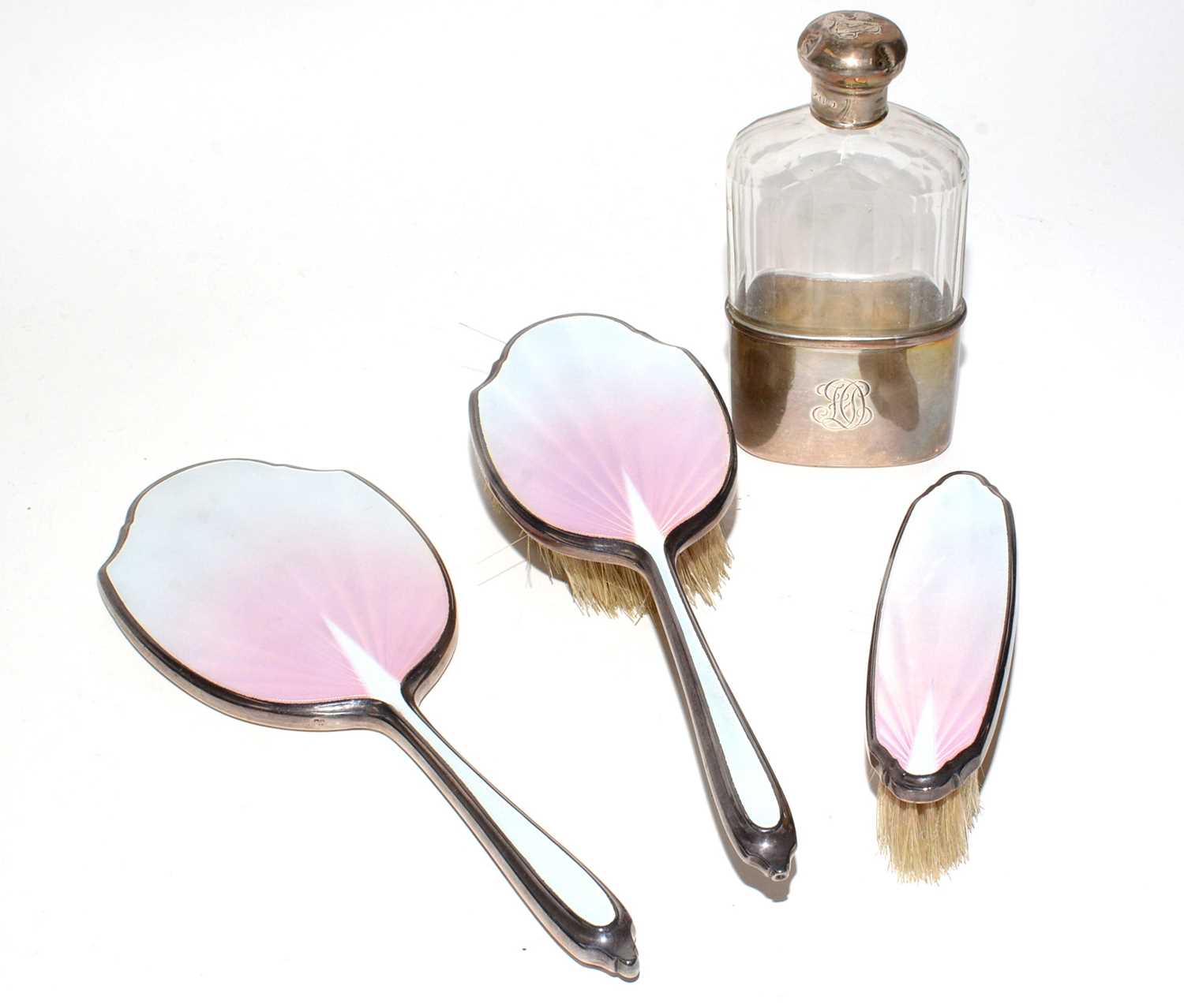 Lot 188 - Silver-backed hand mirror, bush and clothes brush; and a hip flask.