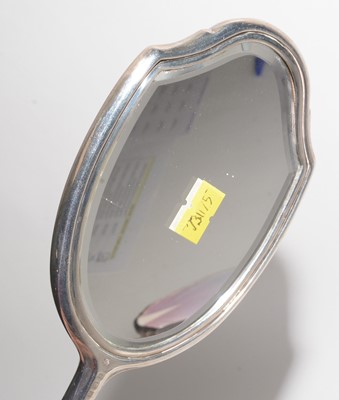 Lot 188 - Silver-backed hand mirror, bush and clothes brush; and a hip flask.