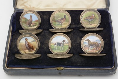 Lot 629 - An Edward VII set of six enamelled silver menu stands/place markers