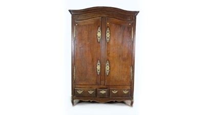 Lot 1343 - A substantial Breton carved oak armoire.