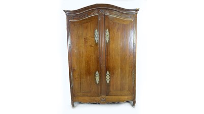 Lot 50 - A substantial Breton carved oak armoire.