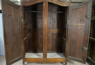 Lot 50 - A substantial Breton carved oak armoire.