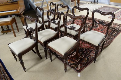 Lot 47 - A set of eight early Victorian mahogany balloon back dining chairs.