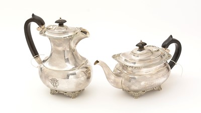 Lot 231 - A silver teapot by Reid & Sons and a silver hot water jug by Barnard & Sons