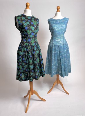 Lot 836 - Two 1950s ready-to-wear day dresses | in painterly blue and green prints