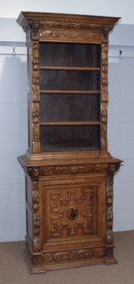 Lot 3 - A profusely carved North European 19th C oak bookcase cabinet.