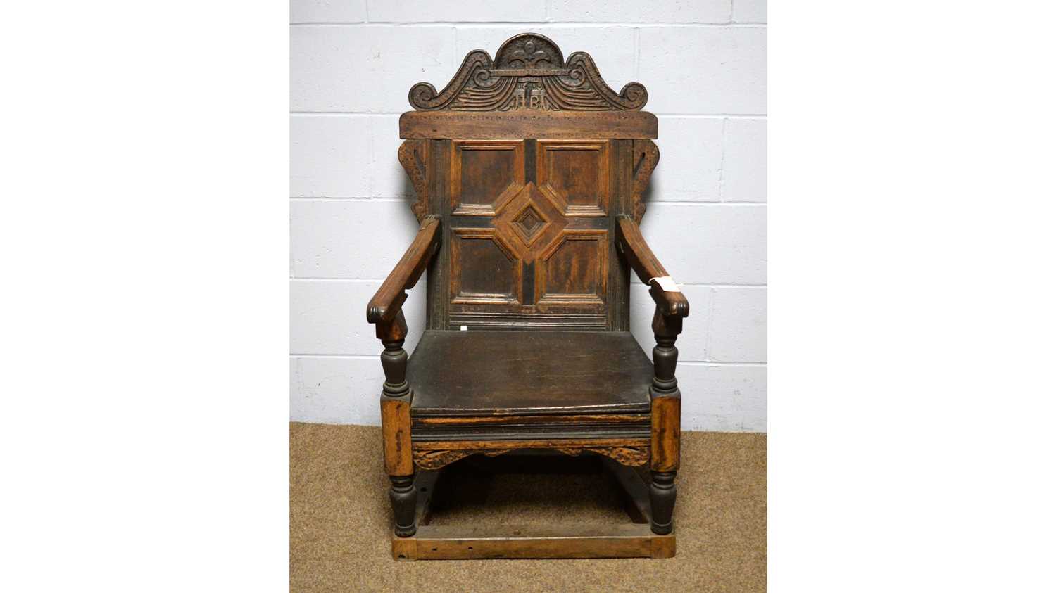 Lot 8 - A 17th Century style oak armchair.
