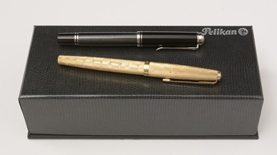 Lot 458 - Pens by Pelikan, Parker and a pen box.