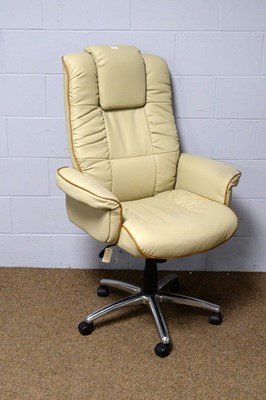 Lot 14 - A cream leather executive office armchair.