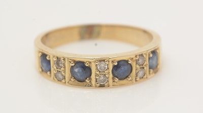 Lot 478 - A sapphire and diamond half-hoop eternity ring