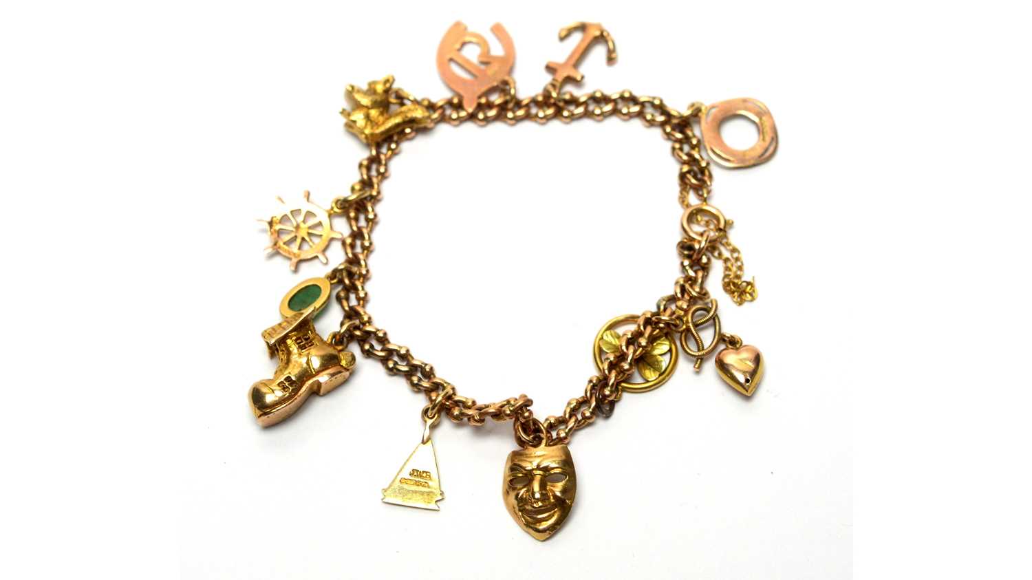 Lot 100 - A 9ct yellow gold charm bracelet