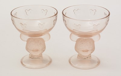 Lot 395 - A pair of Disney Mickey Mouse pattern champagne coupes.