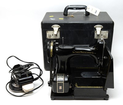 Lot 424 - A Singer 222K sewing machine, in carry case.