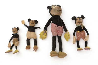 Lot 424 - Four Walt Disney Productions Mickey Mouse felt-topped toys.