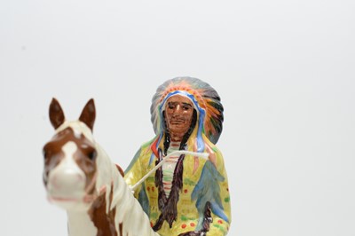 Lot 351 - A Beswick figure of a Native American on Skewbald Horse.