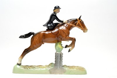 Lot 333 - A Beswick figure of a huntswoman on horseback.