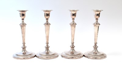 Lot 611 - A set of four George V silver candlesticks, by Crichton Brothers