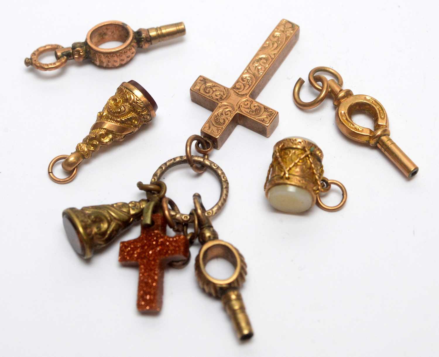 Lot 126 - A selection of gold and other charms and watch keys.