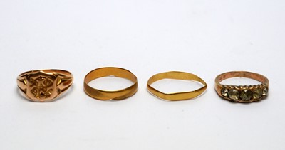 Lot 130 - Four gold rings, one set paste stones