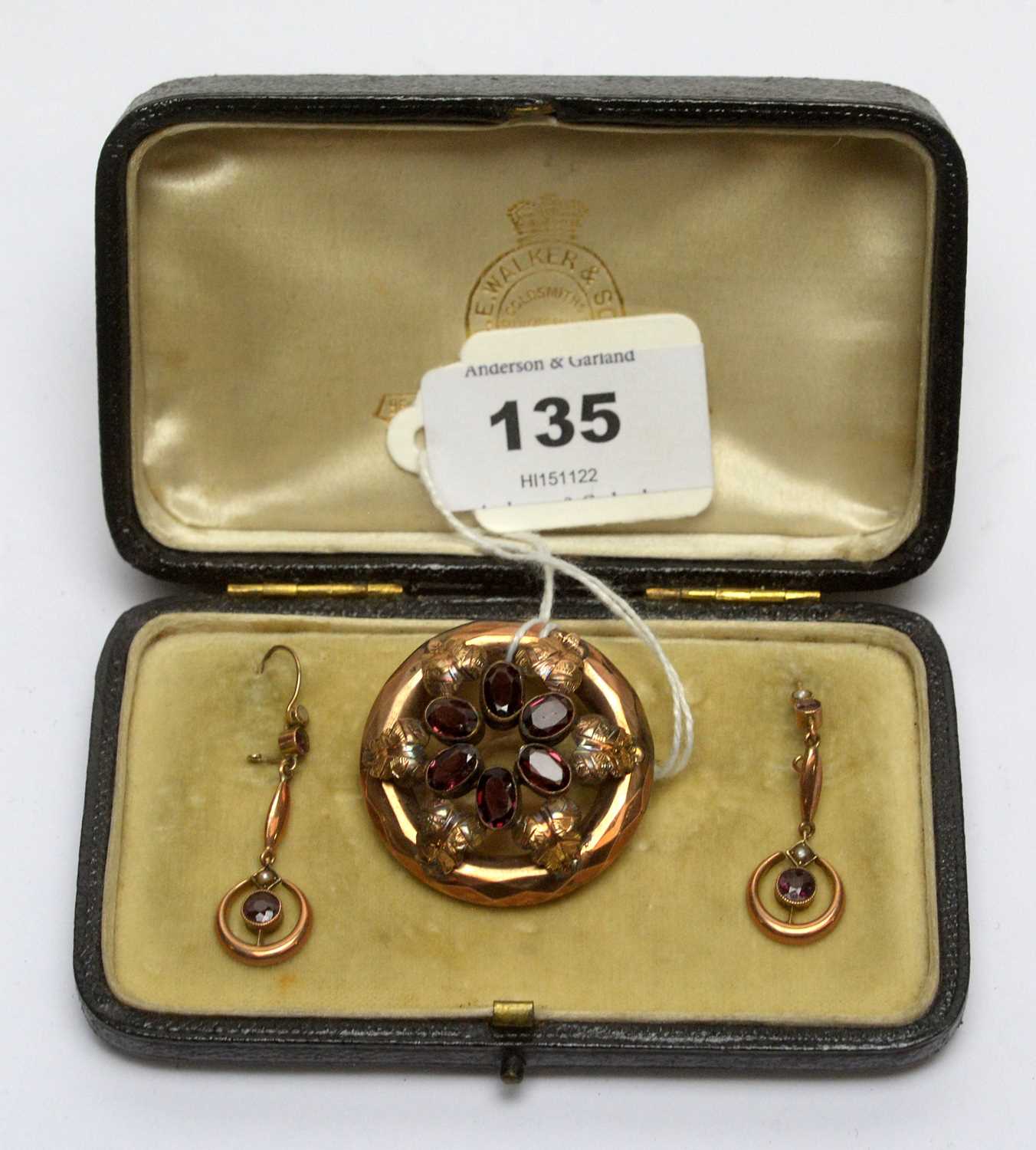 Lot 135 - A Victorian garnet brooch and earrings.