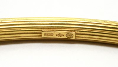 Lot 155 - An 18ct yellow gold bangle