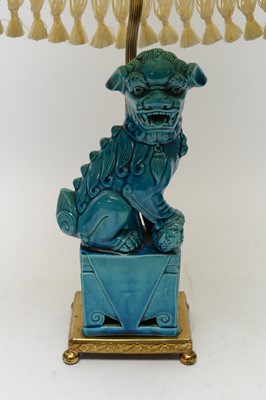 Lot 233 - A pair of Chinese Buddhist lion figures and a lamp