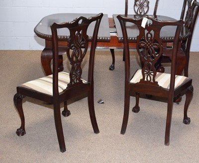 Lot 80 - An early 20th C mahogany extending dining table; and eight chairs.