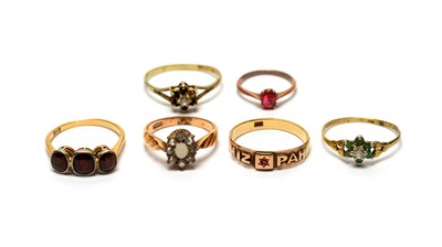 Lot 98 - A three stone garnet ring, and five other rings.