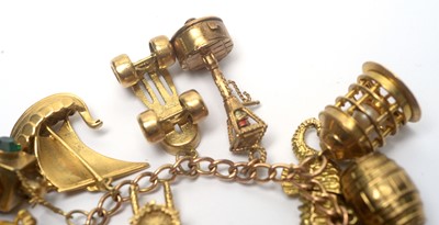 Lot 96 - A 9ct yellow gold charm bracelet