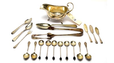 Lot 225 - A silver sauce boat; a selection of silver teaspoons, and other items