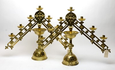 Lot 256 - A pair of brass menorahs
