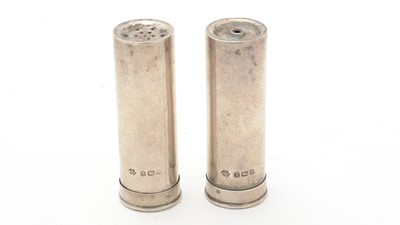 Lot 628 - A pair of Edward VII silver cartridge pattern salt and pepper pots