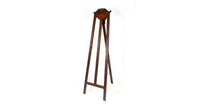 Lot 1249 - An early 20th Century carved mahogany easel stand.