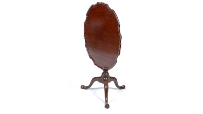 Lot 1320 - A George III mahogany tilt-action tripod table.