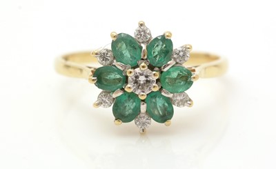 Lot 339 - An emerald and diamond cluster ring