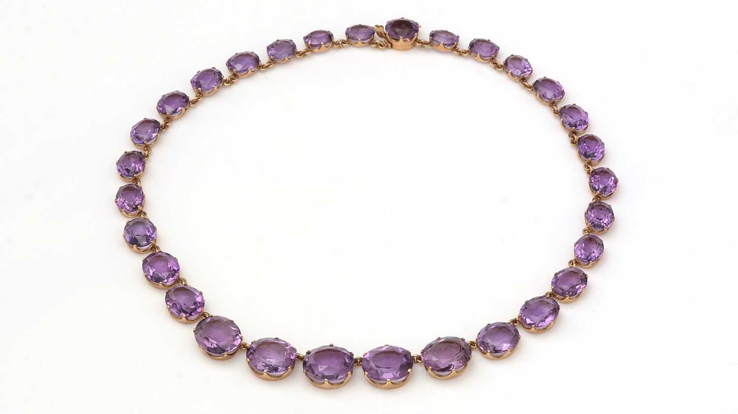 Lot 402 - An Edwardian style amethyst necklace