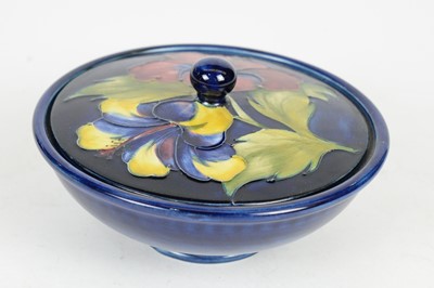 Lot 688 - Two Moorcroft Hibiscus pattern powder bowls and covers.