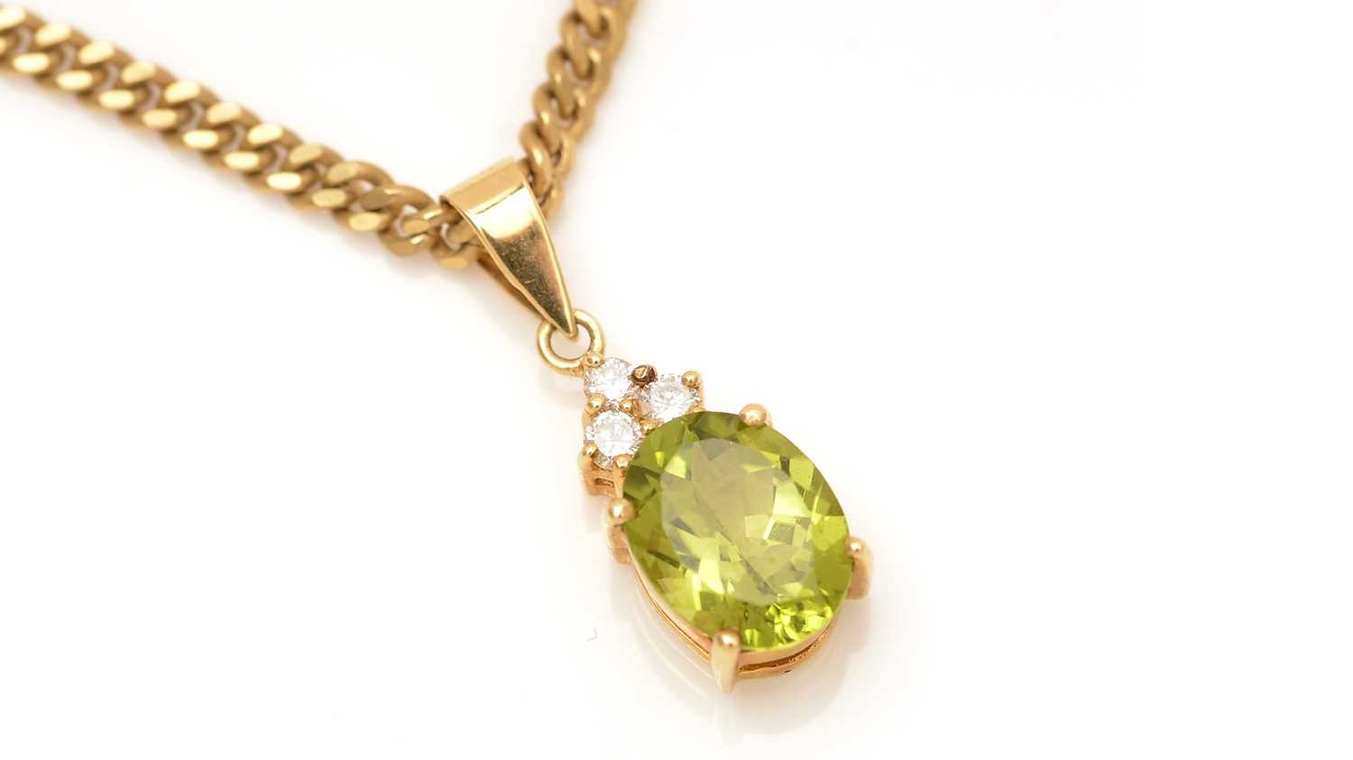 Lot 332 - A peridot and diamond pendant