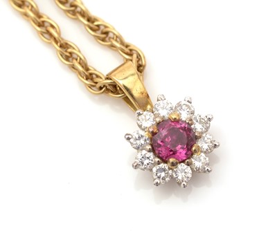 Lot 334 - A ruby and diamond cluster pendant
