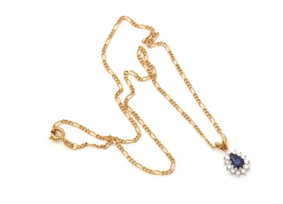 Lot 335 - A sapphire and diamond cluster pendant