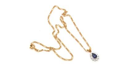 Lot 335 - A sapphire and diamond cluster pendant