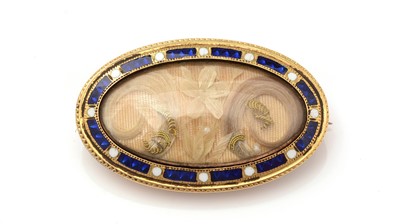 Lot 498 - A Victorian hair-work and enamel mourning brooch
