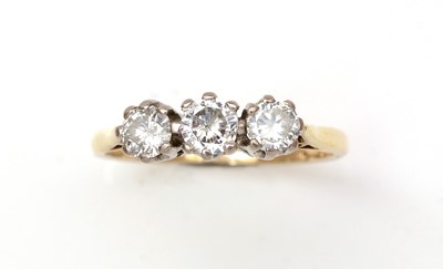 Lot 323 - A three stone diamond ring