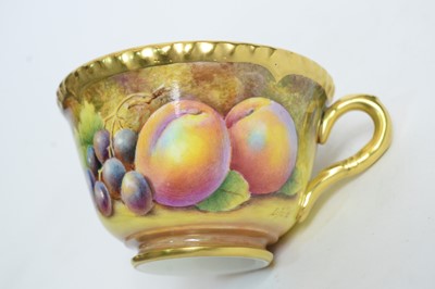 Lot 712 - Fruit painted Worcester teacup and saucer
