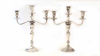Lot 614 - A pair of Victorian silver two-branch three-light candelabra